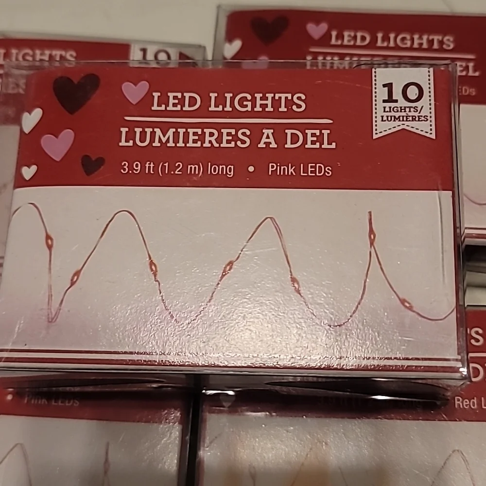 Lot of 7 pink and/or red mini led lights.